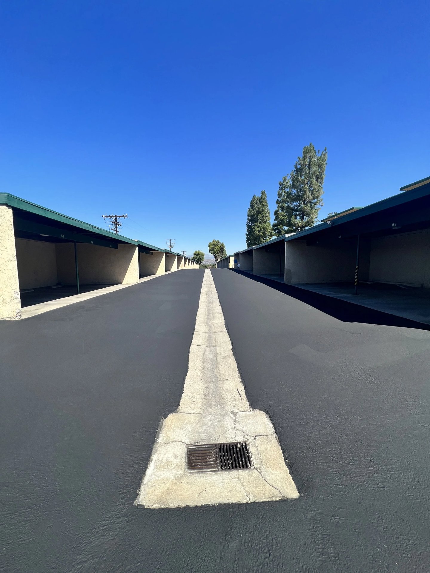 Fresh seal coat application on commercial asphalt